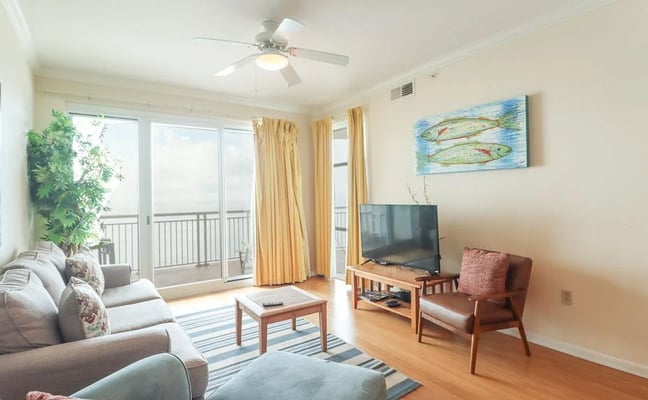 Gulf Horizon Suite Living Room With Gulf Of Mexico Visible Through Balcony Doors